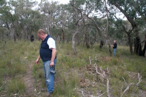 John examining tracks in the bush